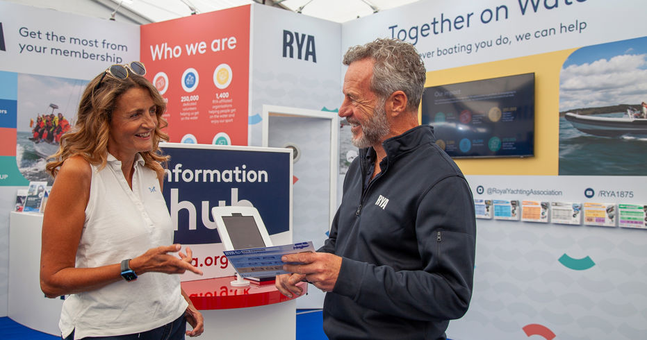 Two people stood in front of together on water RYA stand